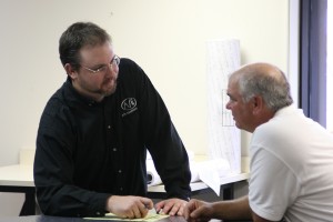 Steve & a client discussing a project